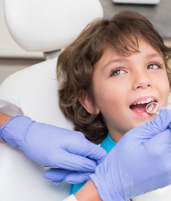 Child smiling during dental exam